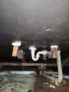 Damaged Vapor Barrier under mobile home