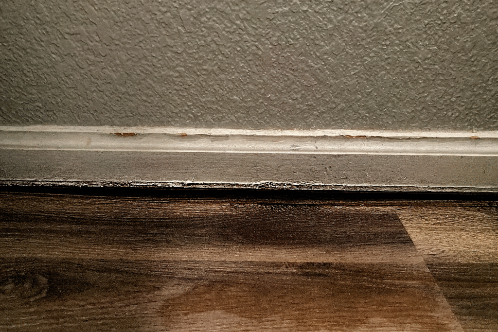 Jack post installation supporting sagging floor from below